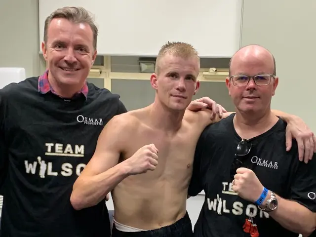boxing professionals posing for a photograph