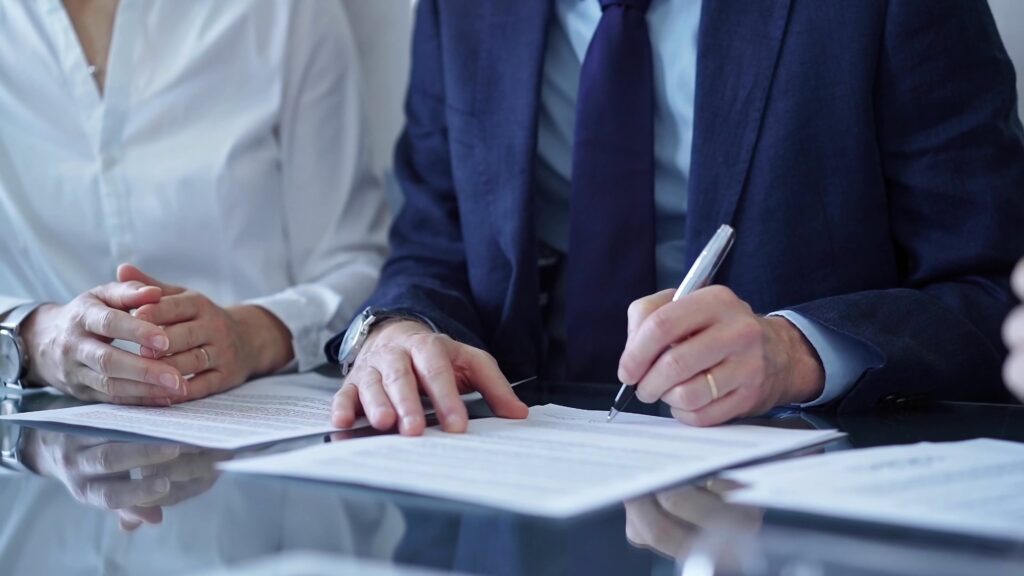 person signing paperwork