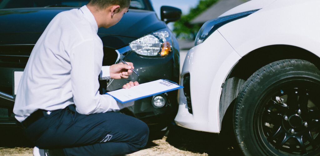 person looking at car collision